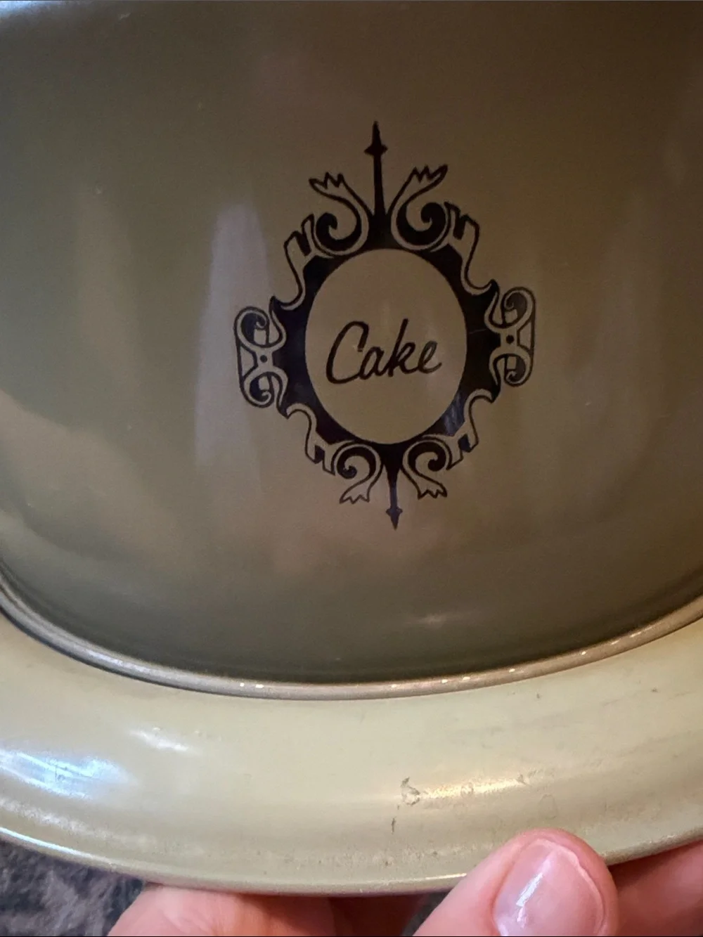 Retro MCM Avocado Green Circular Cake Cover with Decorative Black Logo